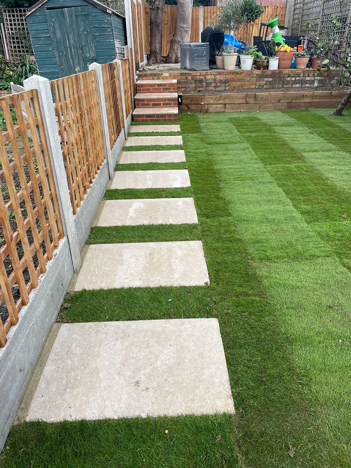 Artificial grass with stepping stones
